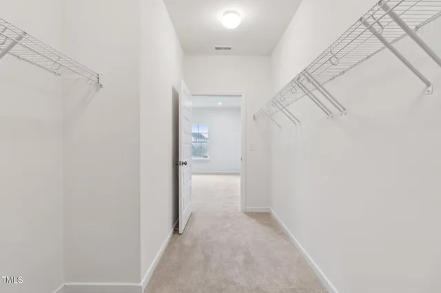 a view of a room with white walls