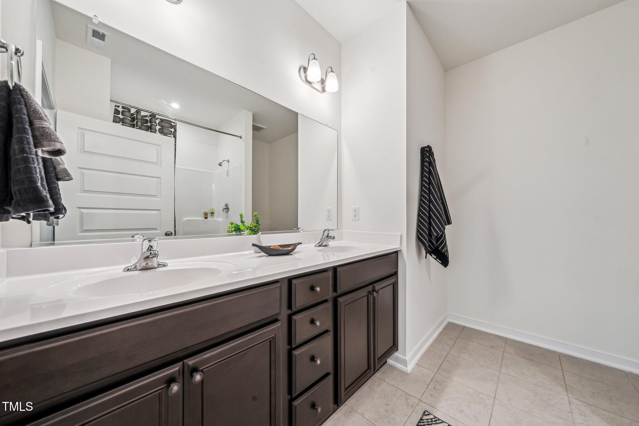 149 Cribbs Lane Middlesex, NC 27557 - Photo 18 of 33 a bathroom with a sink and a mirror