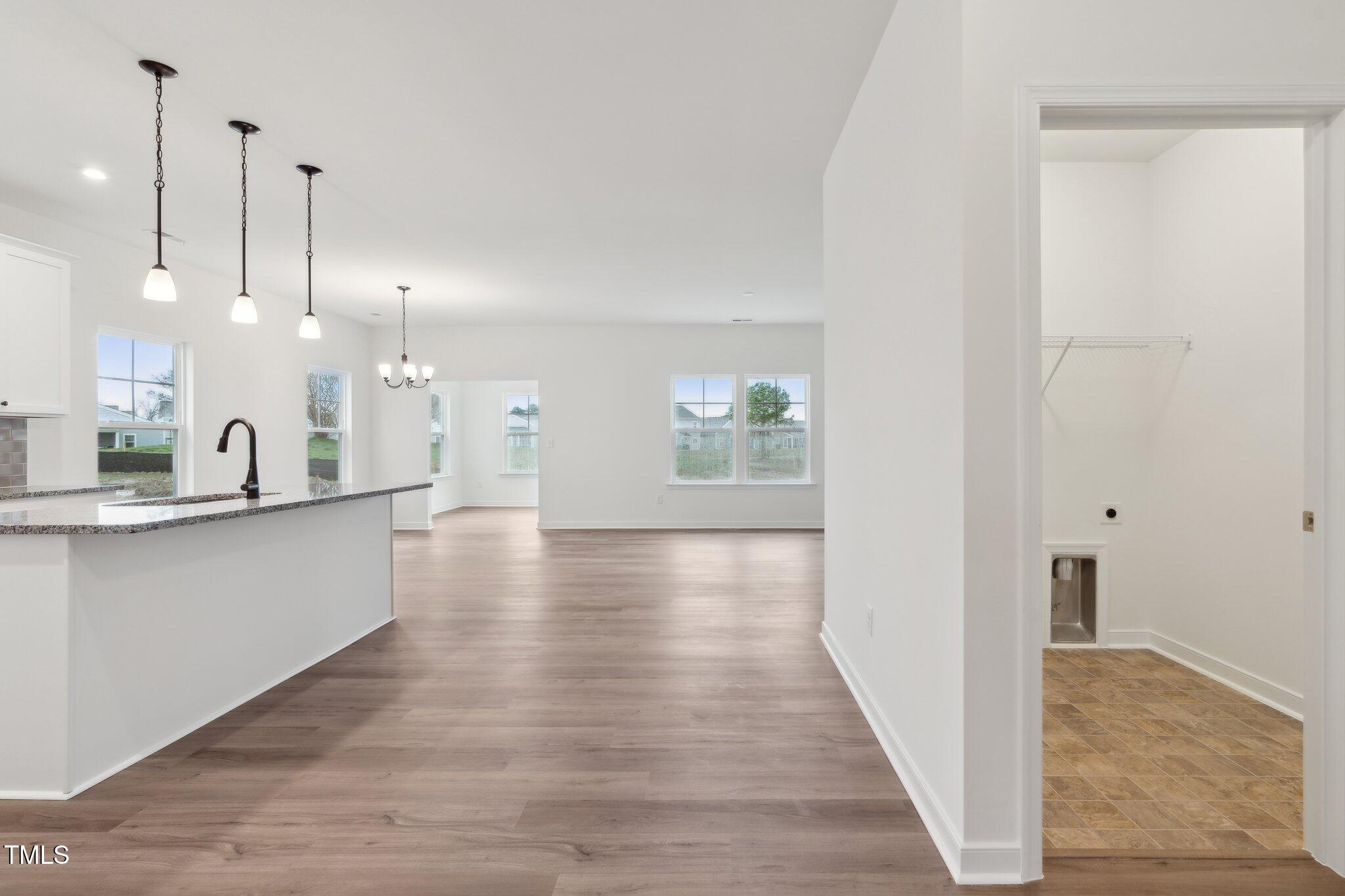 149 Cribbs Lane Middlesex, NC 27557 - Photo 19 of 33 a view of a kitchen with a sink and wooden floor