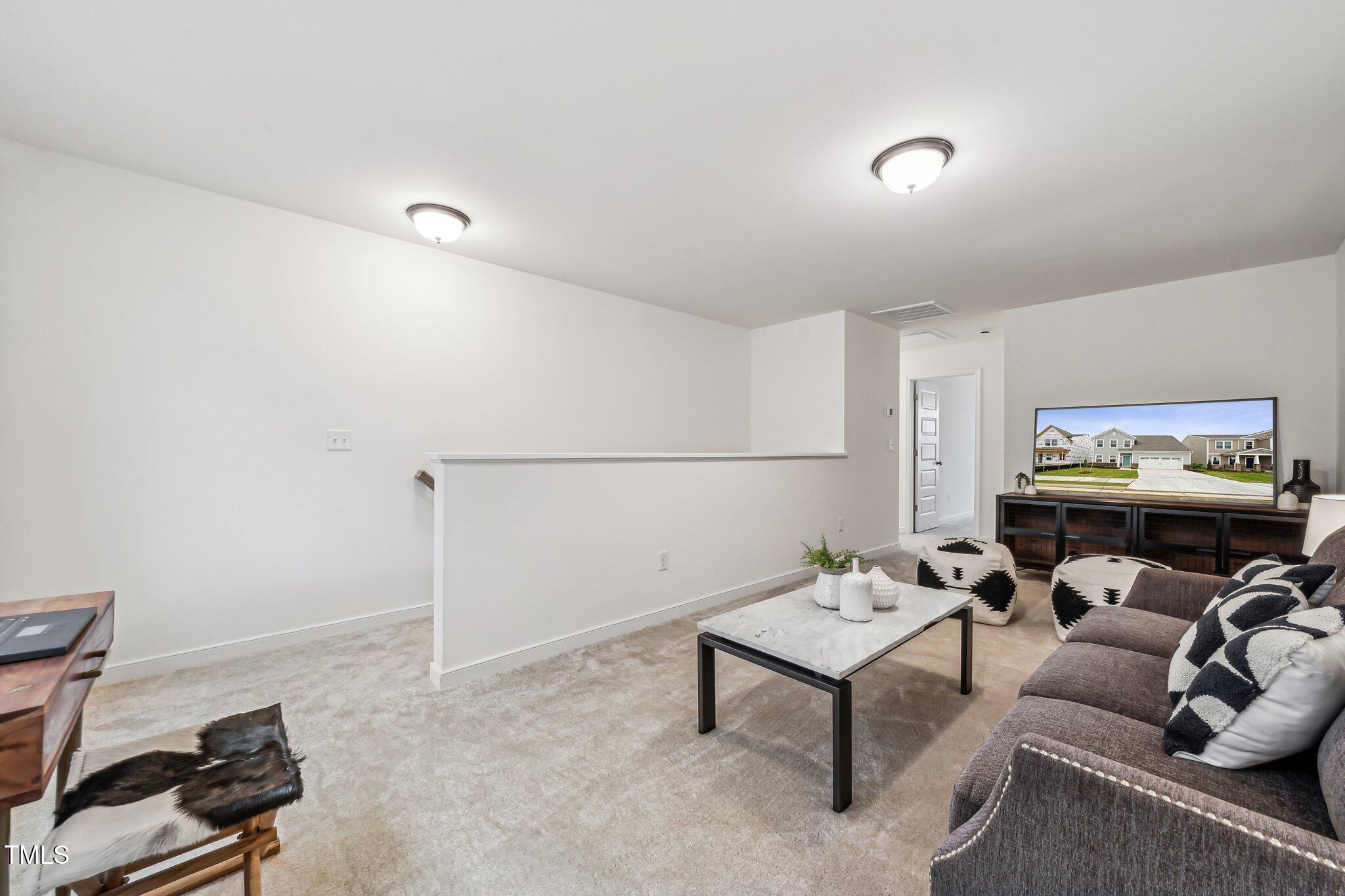 149 Cribbs Lane Middlesex, NC 27557 - Photo 20 of 33 a living room with furniture and a flat screen tv
