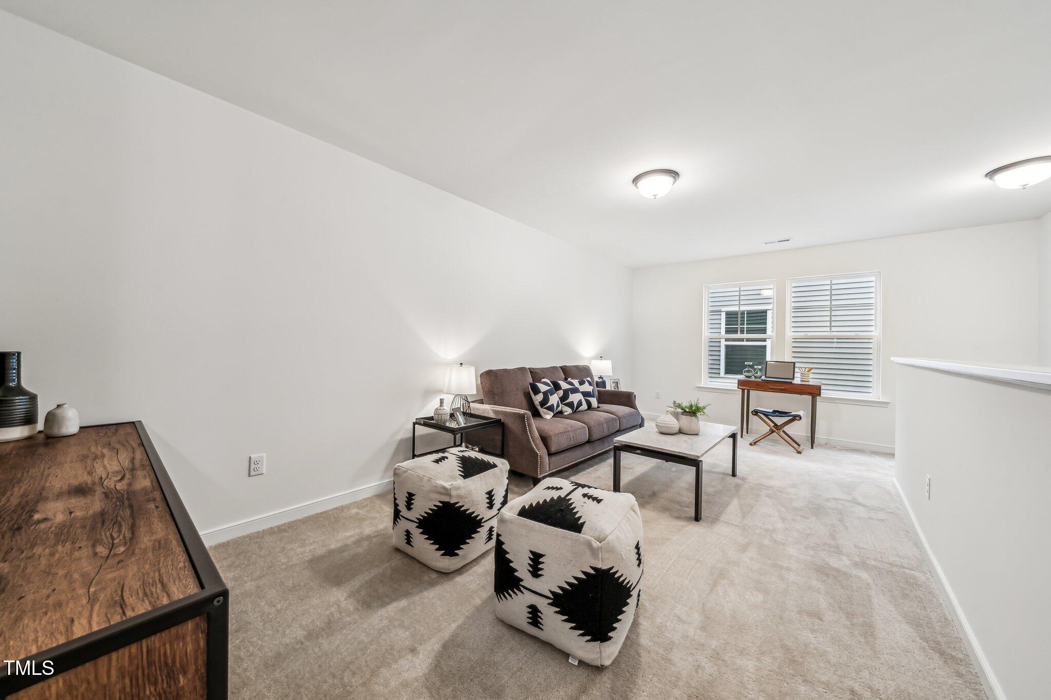 149 Cribbs Lane Middlesex, NC 27557 - Photo 21 of 33 a living room with furniture and a rug
