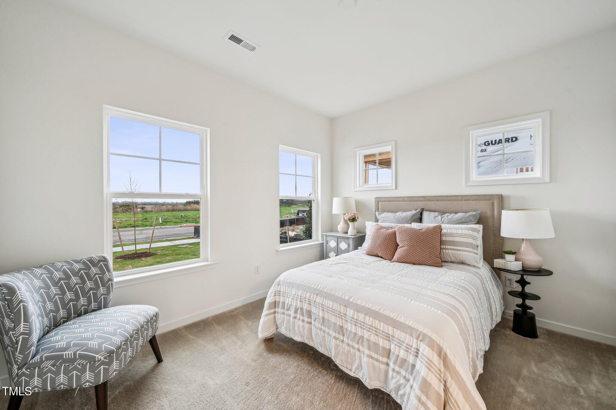 149 Cribbs Lane Middlesex, NC 27557 - Photo 3 of 33 a bedroom with a bed and a couch