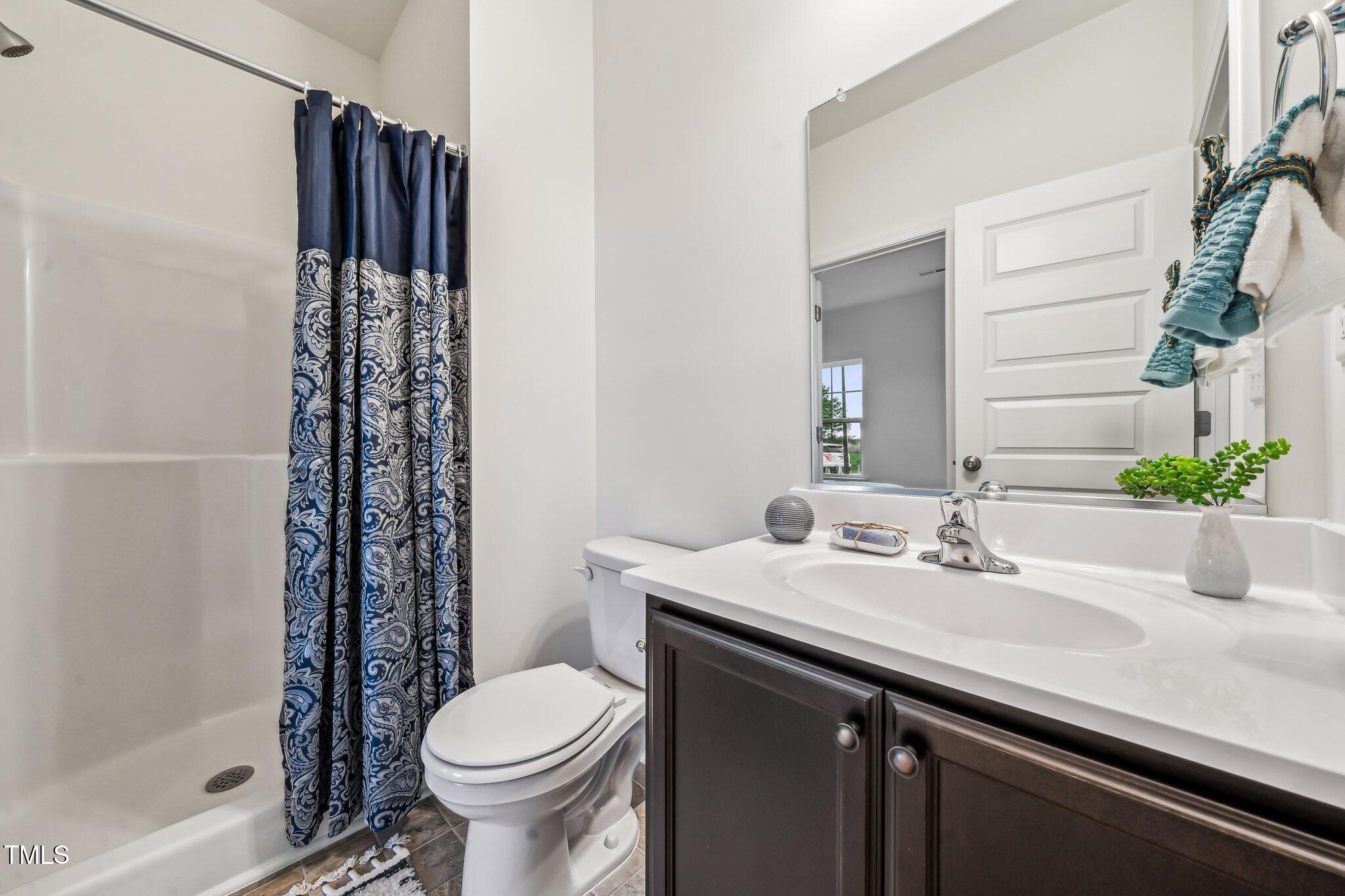 149 Cribbs Lane Middlesex, NC 27557 - Photo 5 of 33 a bathroom with a sink toilet and shower