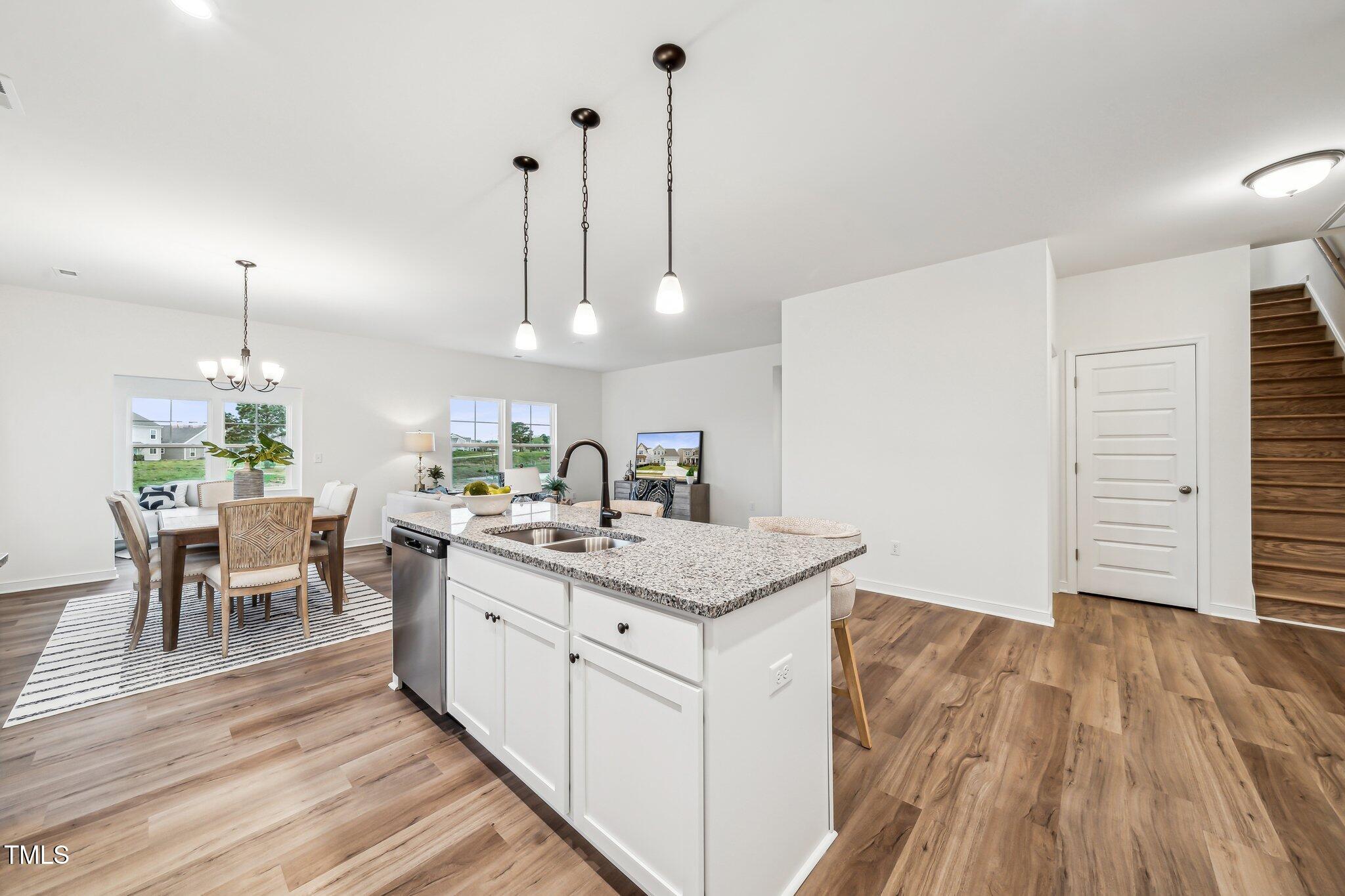 149 Cribbs Lane Middlesex, NC 27557 - Photo 8 of 33 a kitchen with a sink and wooden floor