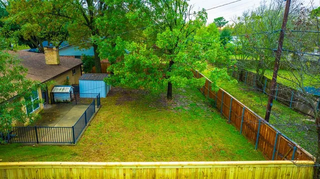 a view of house with swimming pool