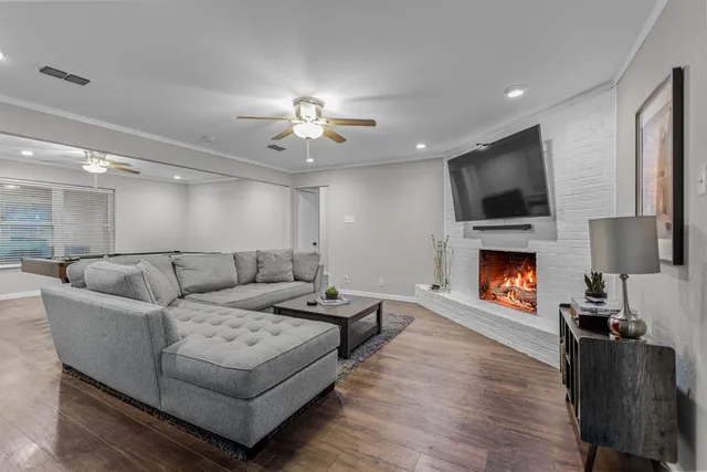 a living room with furniture fireplace and a flat screen tv