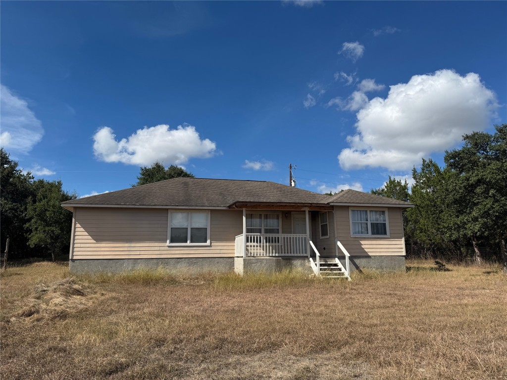 2793 Contour Drive Spring Branch, TX 78070 - Photo 3 of 4 a front view of a house with garden