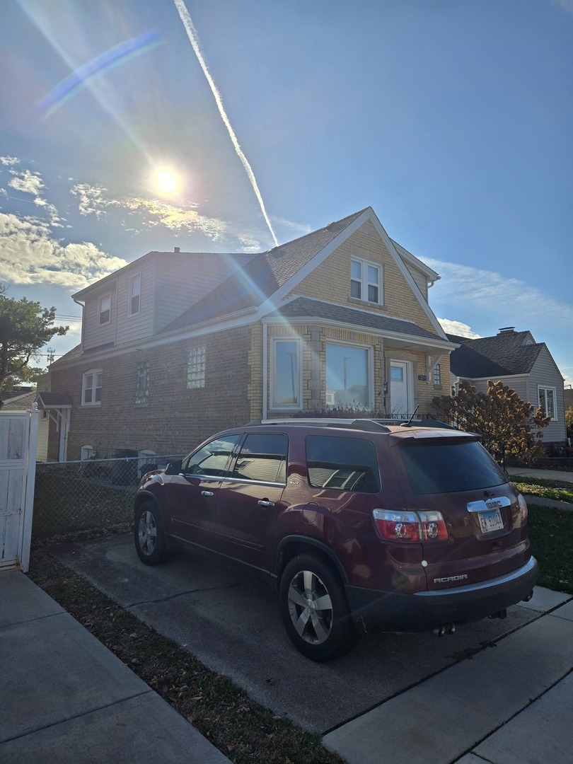 7229 57th Place Summit, IL 60501 - Photo 2 of 2 a car parked in front of a house