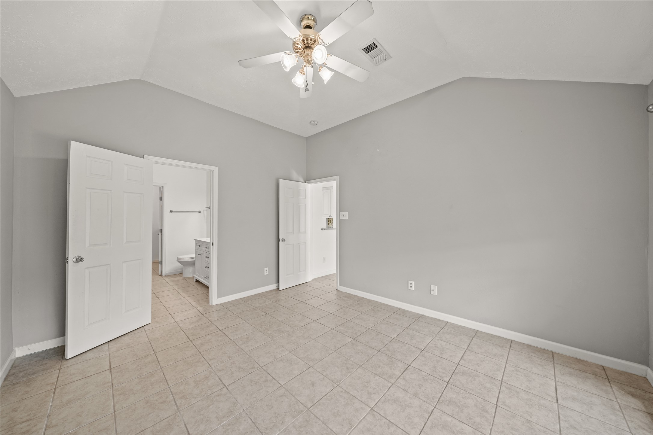 8134 Blue Jay Street Baytown, TX 77523 - Photo 19 of 31 Large windows fill the primary bedroom with natural light, creating a bright and airy feel throughout the space. With ample room for furnishings and a layout designed for both comfort and functionality, this suite offers the perfect balance of relaxation and everyday living.