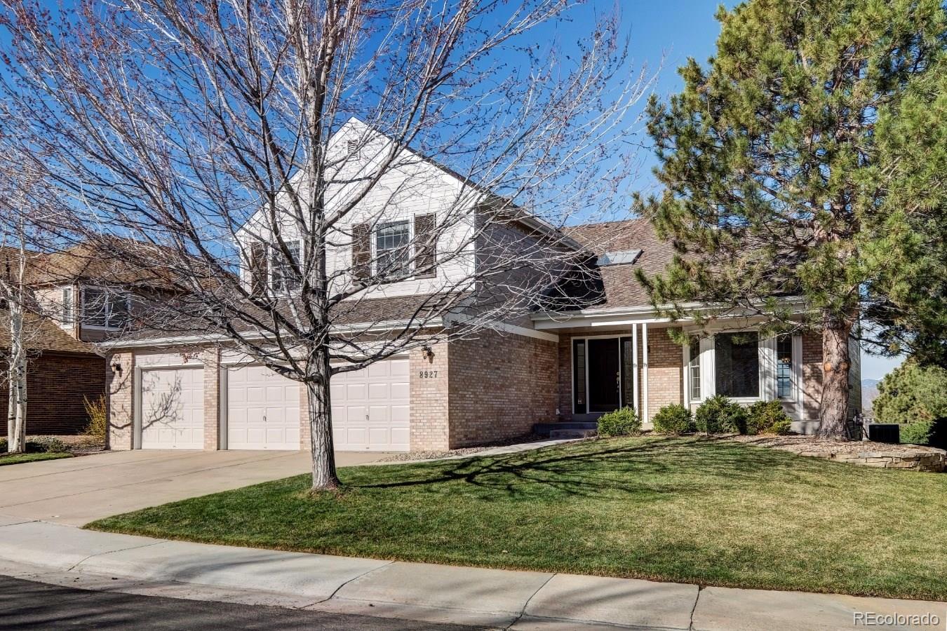 8927 Mountain Laurel Way Highlands Ranch, CO 80126 - Photo 1 of 35 a front view of house with a garden