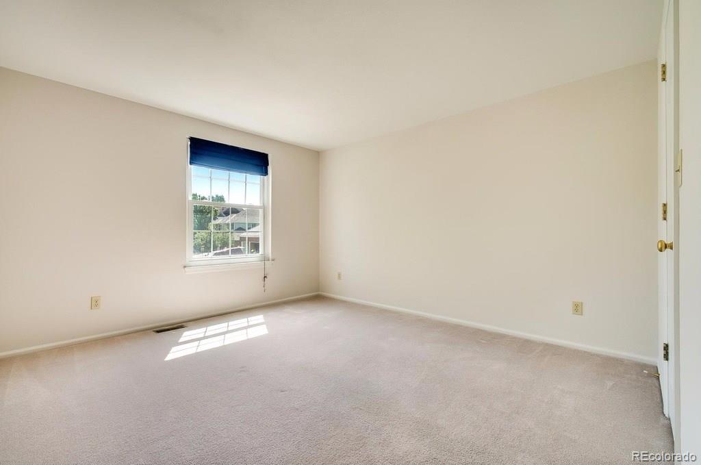 8927 Mountain Laurel Way Highlands Ranch, CO 80126 - Photo 24 of 35 an empty room with windows