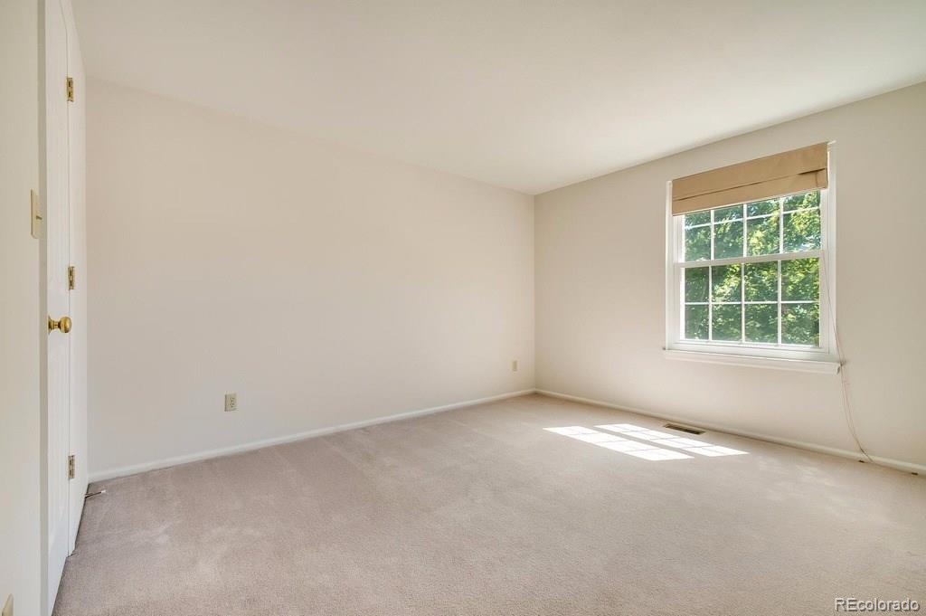 8927 Mountain Laurel Way Highlands Ranch, CO 80126 - Photo 25 of 35 an empty room with windows