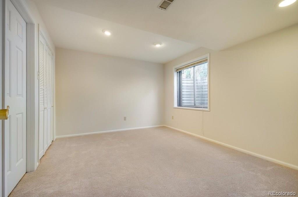 8927 Mountain Laurel Way Highlands Ranch, CO 80126 - Photo 28 of 35 an empty room with windows