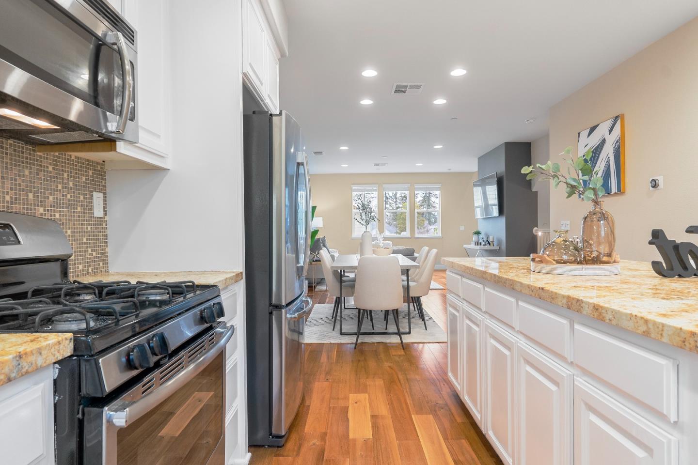 79 Braxton Terrace Campbell, CA 95008 - Photo 13 of 36 a kitchen with sink stove and cabinets