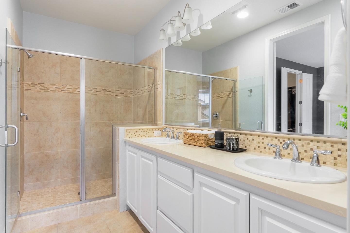 79 Braxton Terrace Campbell, CA 95008 - Photo 18 of 36 a bathroom with a double vanity sink mirror and shower