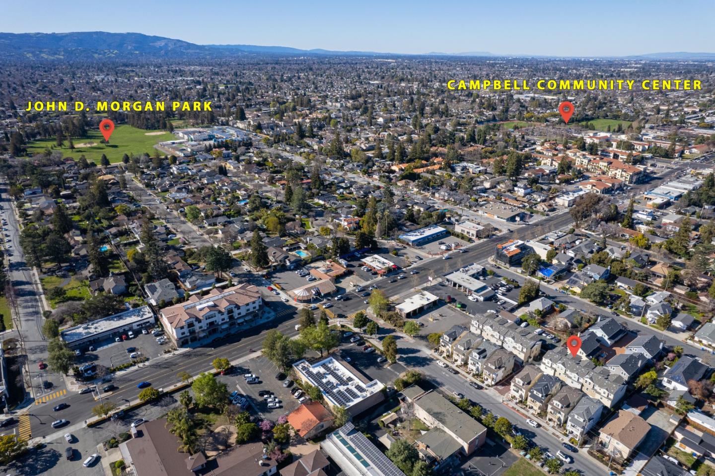 79 Braxton Terrace Campbell, CA 95008 - Photo 31 of 36 an aerial view of a city with lots of residential buildings and mountain view in back