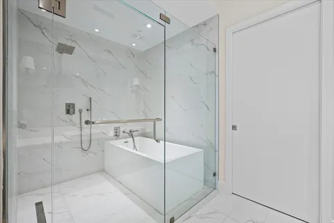 a bathroom with a sink mirror and toilet