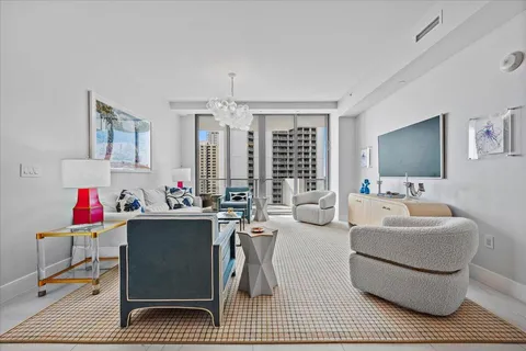 a kitchen with white cabinets and appliances