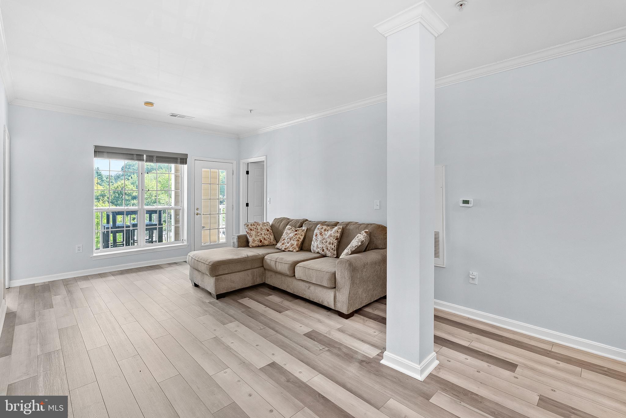 4551 Strutfield Lane, Unit 4111 Alexandria, VA 22311 - Photo 13 of 35 a living room with furniture and a window