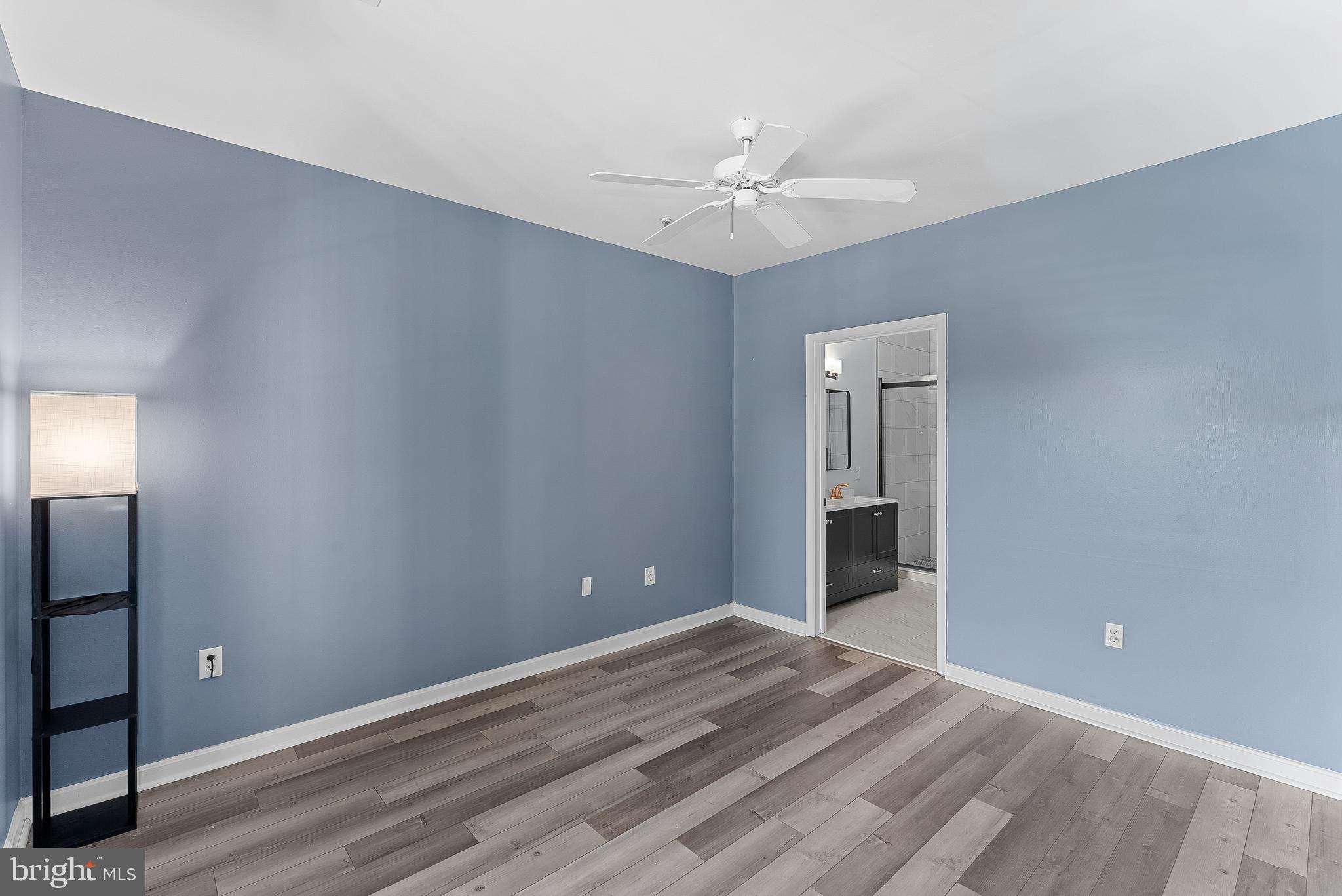 4551 Strutfield Lane, Unit 4111 Alexandria, VA 22311 - Photo 16 of 35 a view of an empty room with window and wooden floor