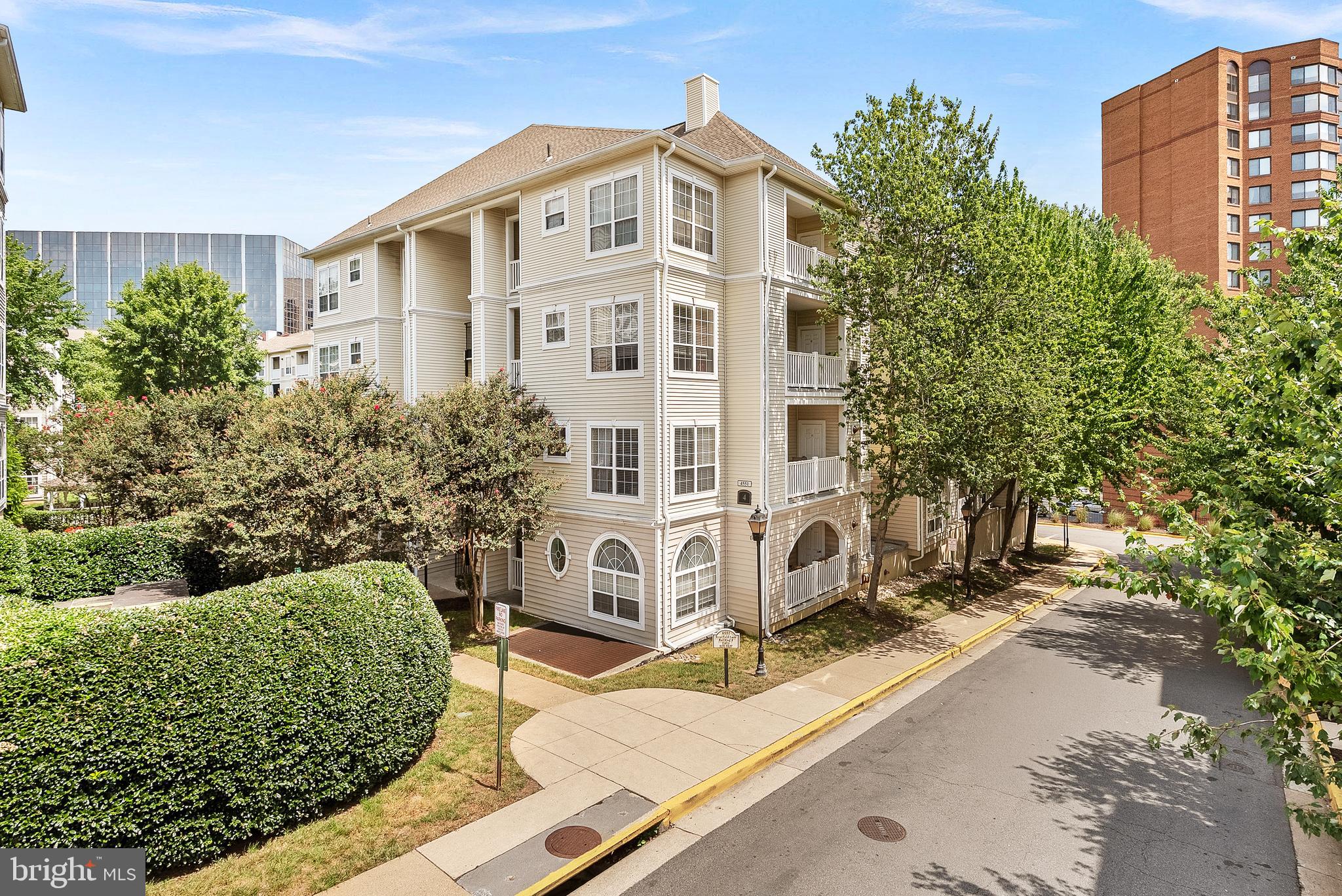 4551 Strutfield Lane, Unit 4111 Alexandria, VA 22311 - Photo 2 of 35 a front view of a house with a garden