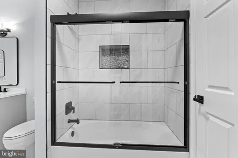 a bathroom with a bath tub