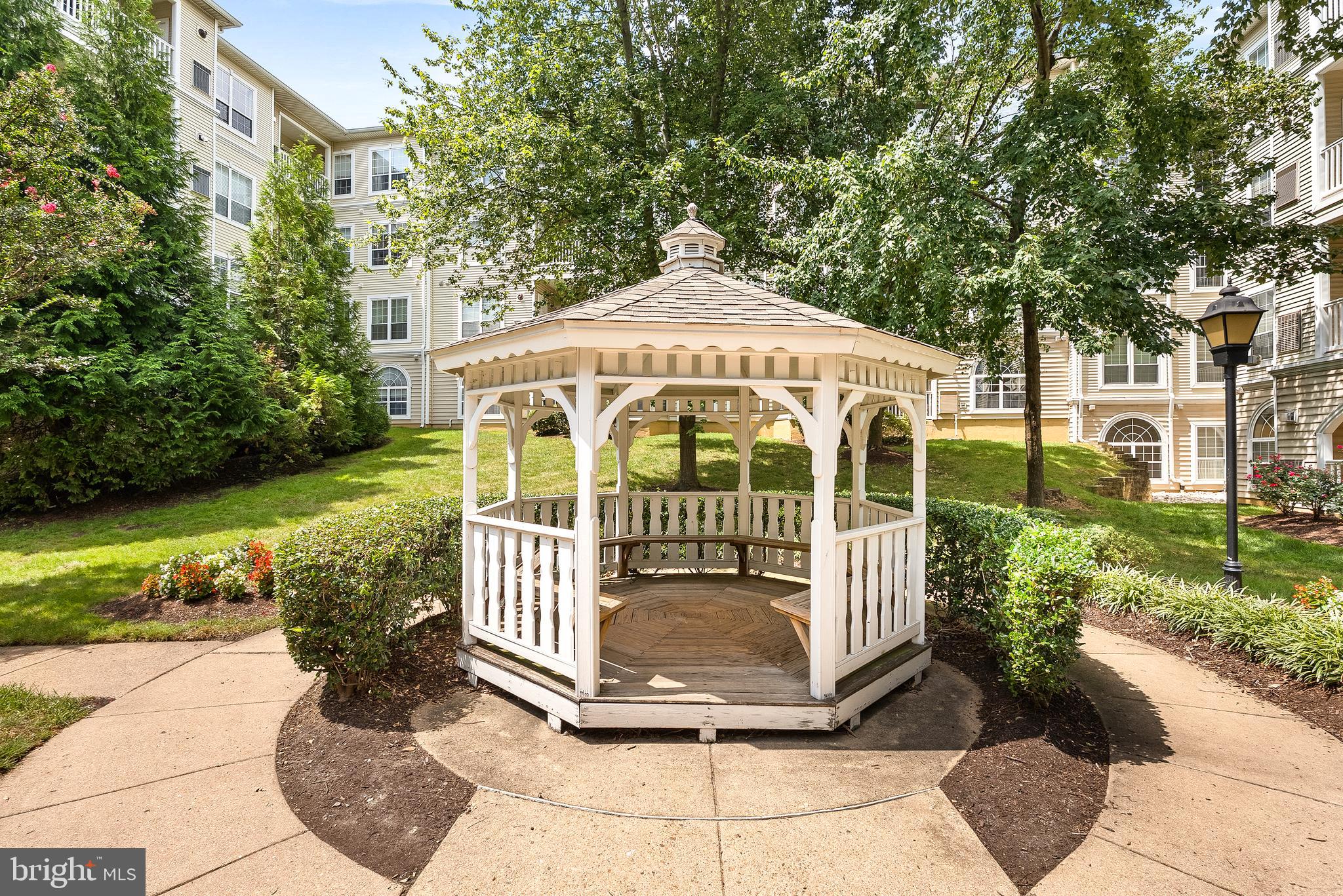 4551 Strutfield Lane, Unit 4111 Alexandria, VA 22311 - Photo 32 of 35 a view of a garden with large trees