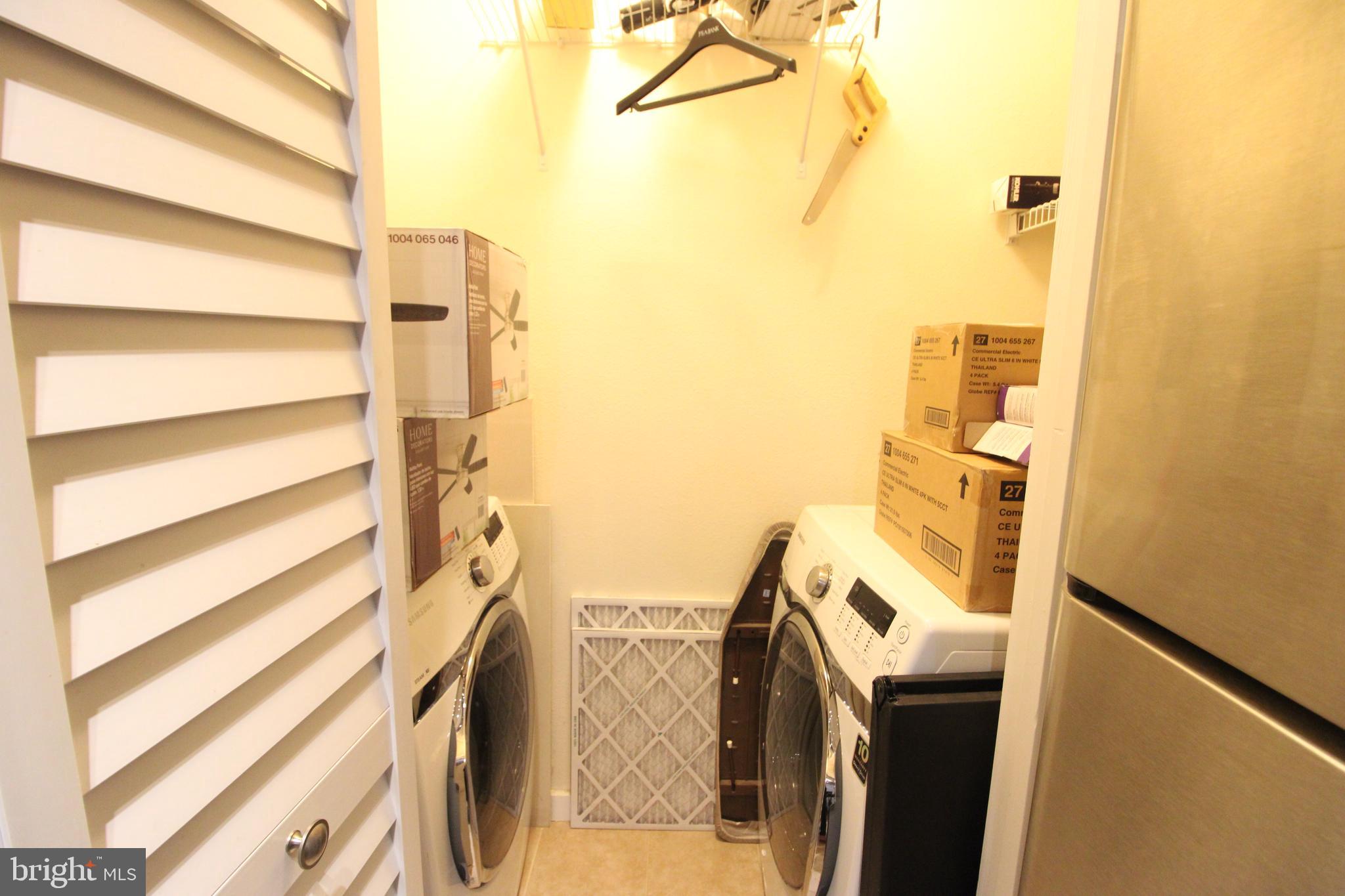 1570 Spring Gate Dr., Unit 7113 McLean, VA 22102 - Photo 7 of 8 a view of walk in closet with empty racks