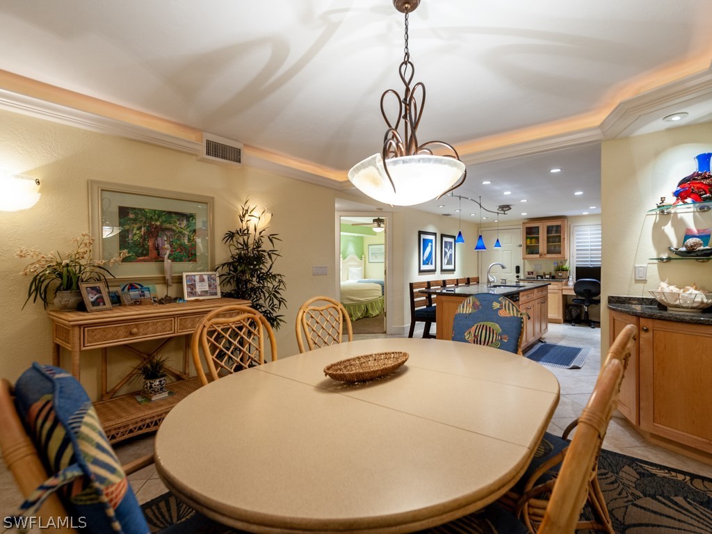 2445 West Gulf Drive, Unit E2 Sanibel, FL 33957 - Photo 13 of 35 a view of a dining room with furniture
