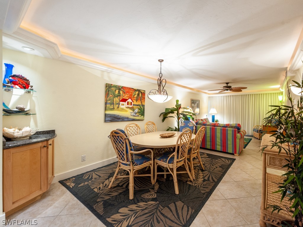 2445 West Gulf Drive, Unit E2 Sanibel, FL 33957 - Photo 14 of 35 a view of a dining room with furniture