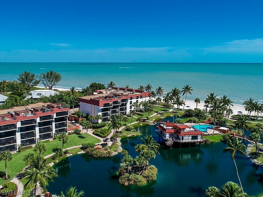 2445 West Gulf Drive, Unit E2 Sanibel, FL 33957 - Photo 2 of 35 a view of a store with many potted plants