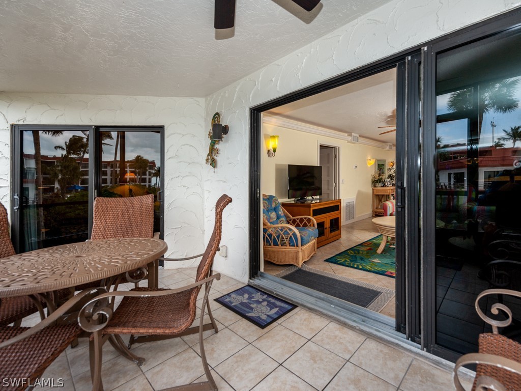 2445 West Gulf Drive, Unit E2 Sanibel, FL 33957 - Photo 21 of 35 a view of a dining room with furniture