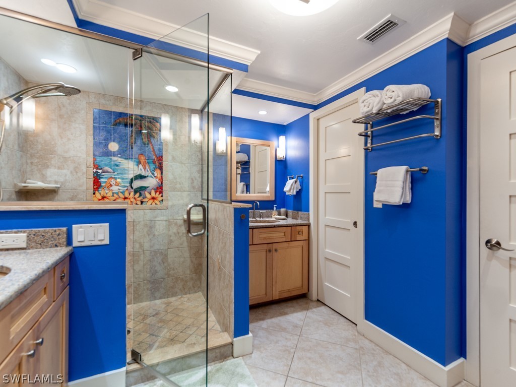 2445 West Gulf Drive, Unit E2 Sanibel, FL 33957 - Photo 24 of 35 a kitchen with stainless steel appliances granite countertop a refrigerator and a sink