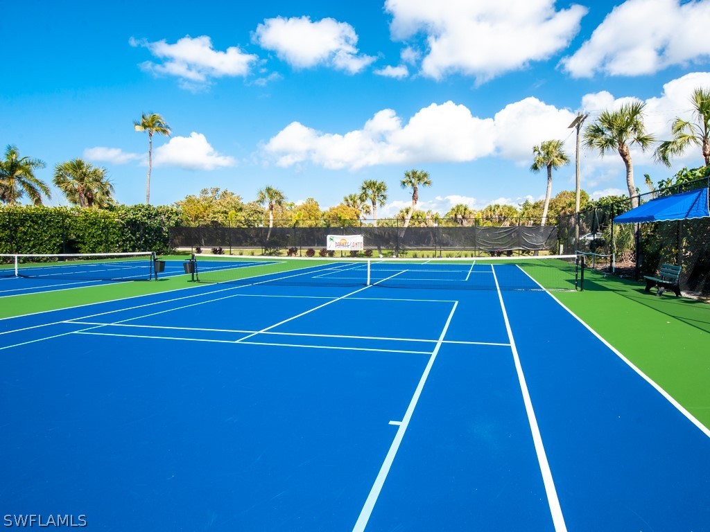 2445 West Gulf Drive, Unit E2 Sanibel, FL 33957 - Photo 33 of 35 a view of an outdoor space and tennis court