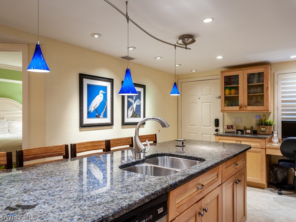 2445 West Gulf Drive, Unit E2 Sanibel, FL 33957 - Photo 6 of 35 a kitchen with sink and a refrigerator