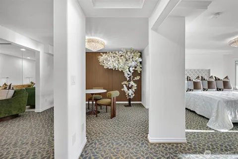 a bedroom with furniture and a window