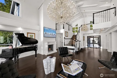 a living room with fireplace furniture and a wooden floor