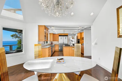 a dining room with furniture and wooden floor