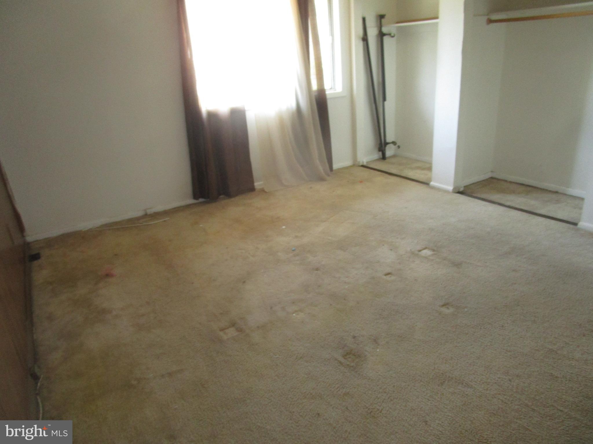 3142 Brinkley Road, Unit 304 Temple Hills, MD 20748 - Photo 3 of 7 an empty room with windows