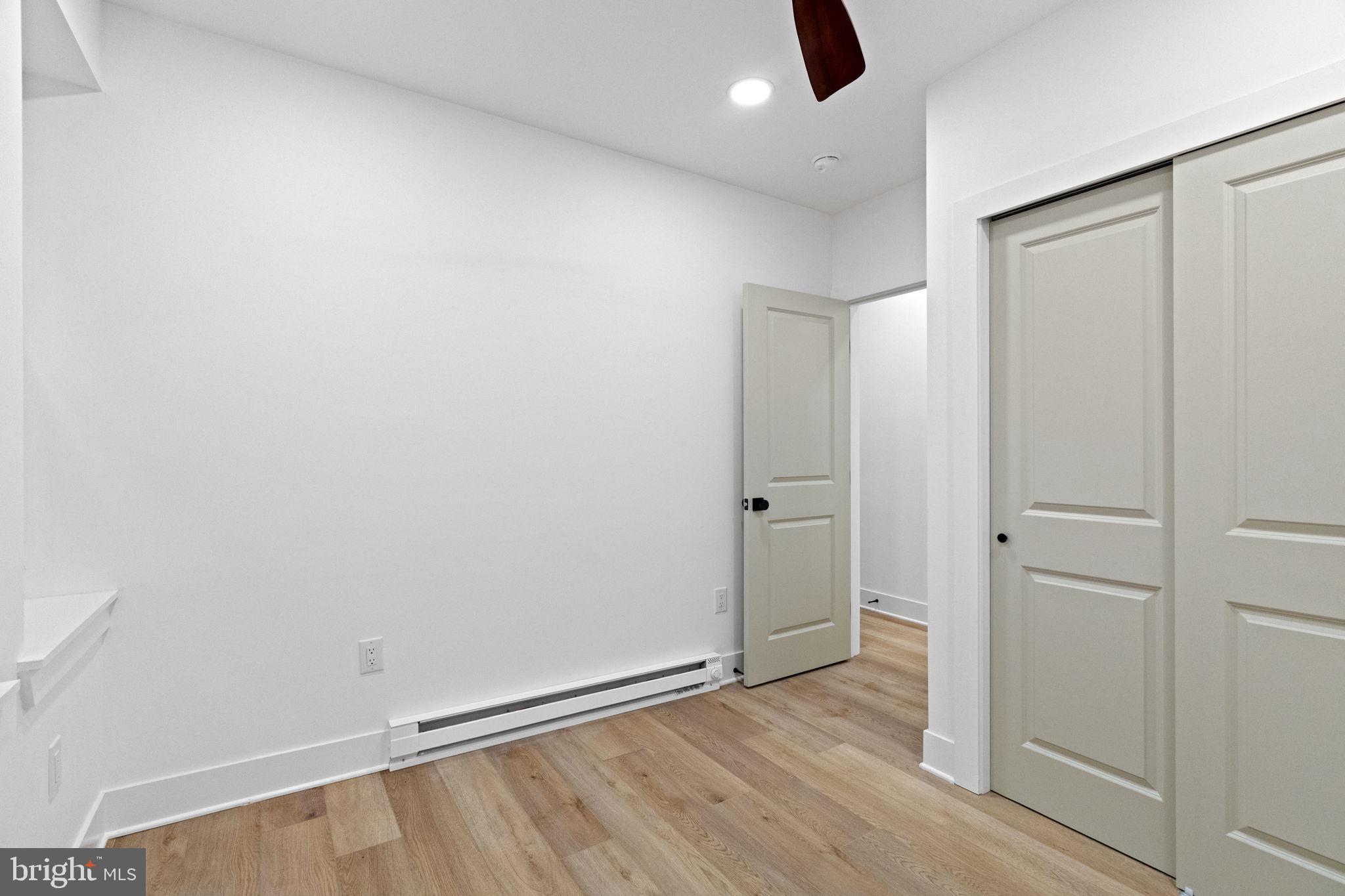 1502 South 52nd Street Philadelphia, PA 19143 - Photo 12 of 34 wooden floor in an empty room