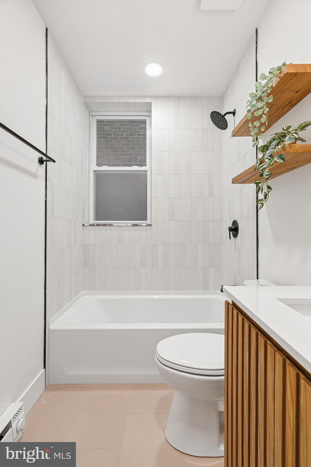 1502 South 52nd Street Philadelphia, PA 19143 - Photo 14 of 34 a bathroom with a toilet and a bathtub
