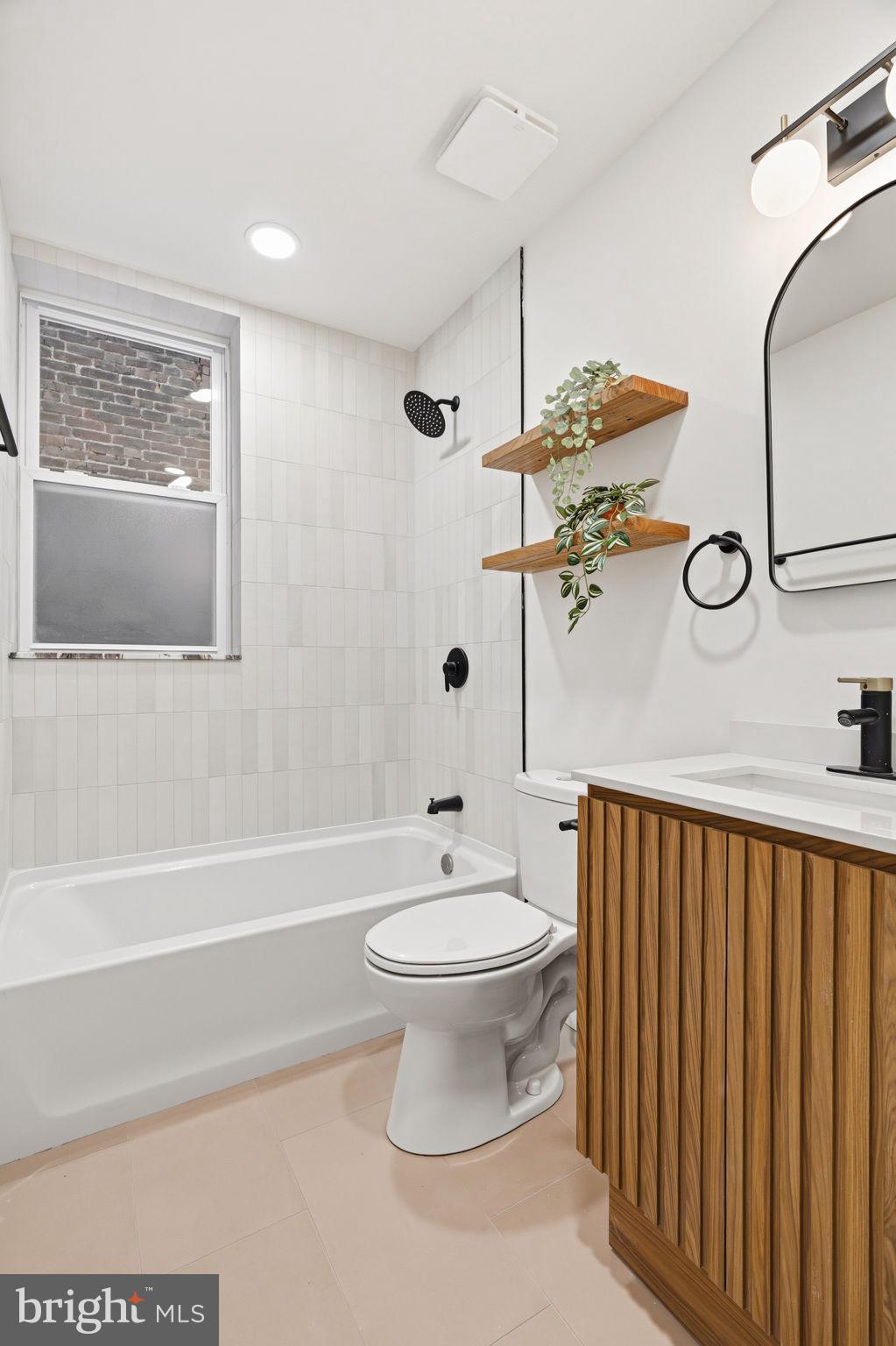 1502 South 52nd Street Philadelphia, PA 19143 - Photo 15 of 34 a bathroom with a toilet a sink and bathtub