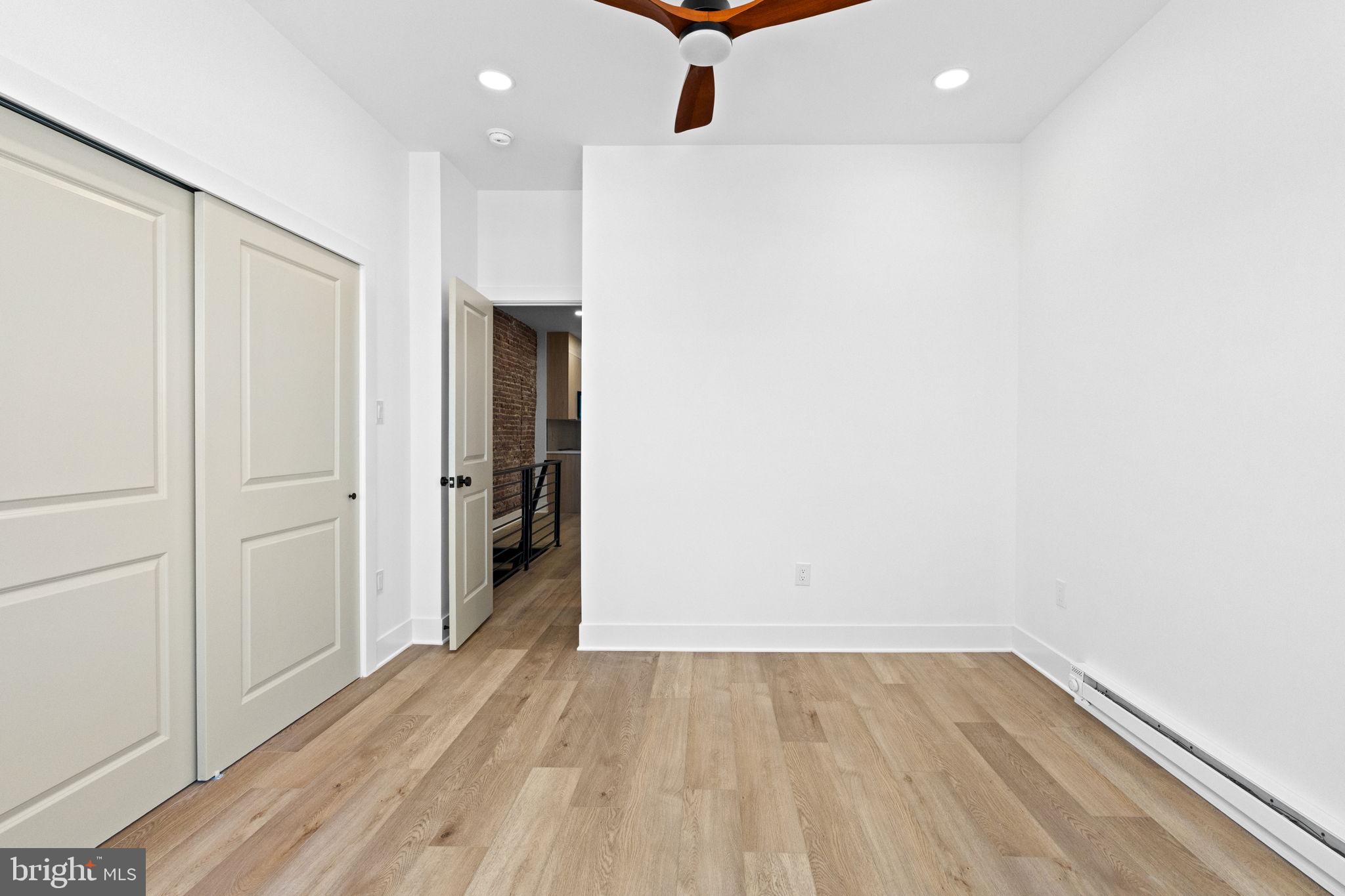 1502 South 52nd Street Philadelphia, PA 19143 - Photo 21 of 34 a view of an empty room with wooden floor and closet