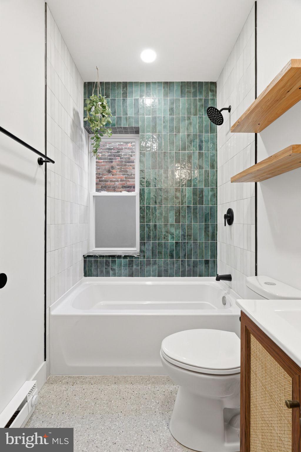1502 South 52nd Street Philadelphia, PA 19143 - Photo 22 of 34 a bathroom with a toilet a sink and bathtub