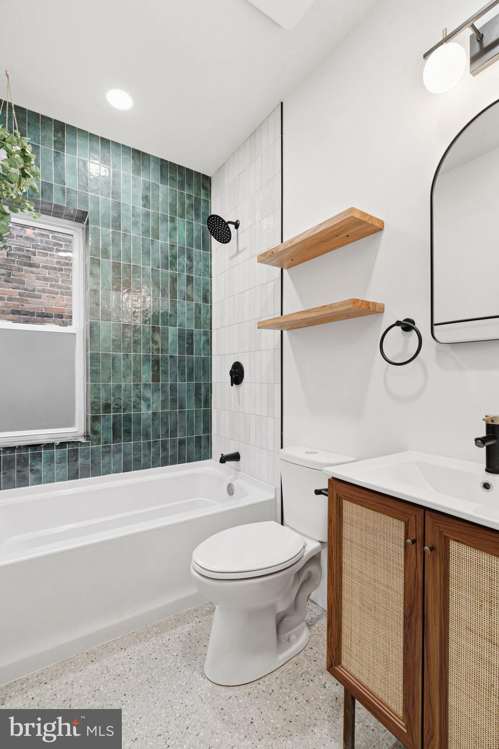 1502 South 52nd Street Philadelphia, PA 19143 - Photo 23 of 34 a bathroom with a toilet a sink and a shower
