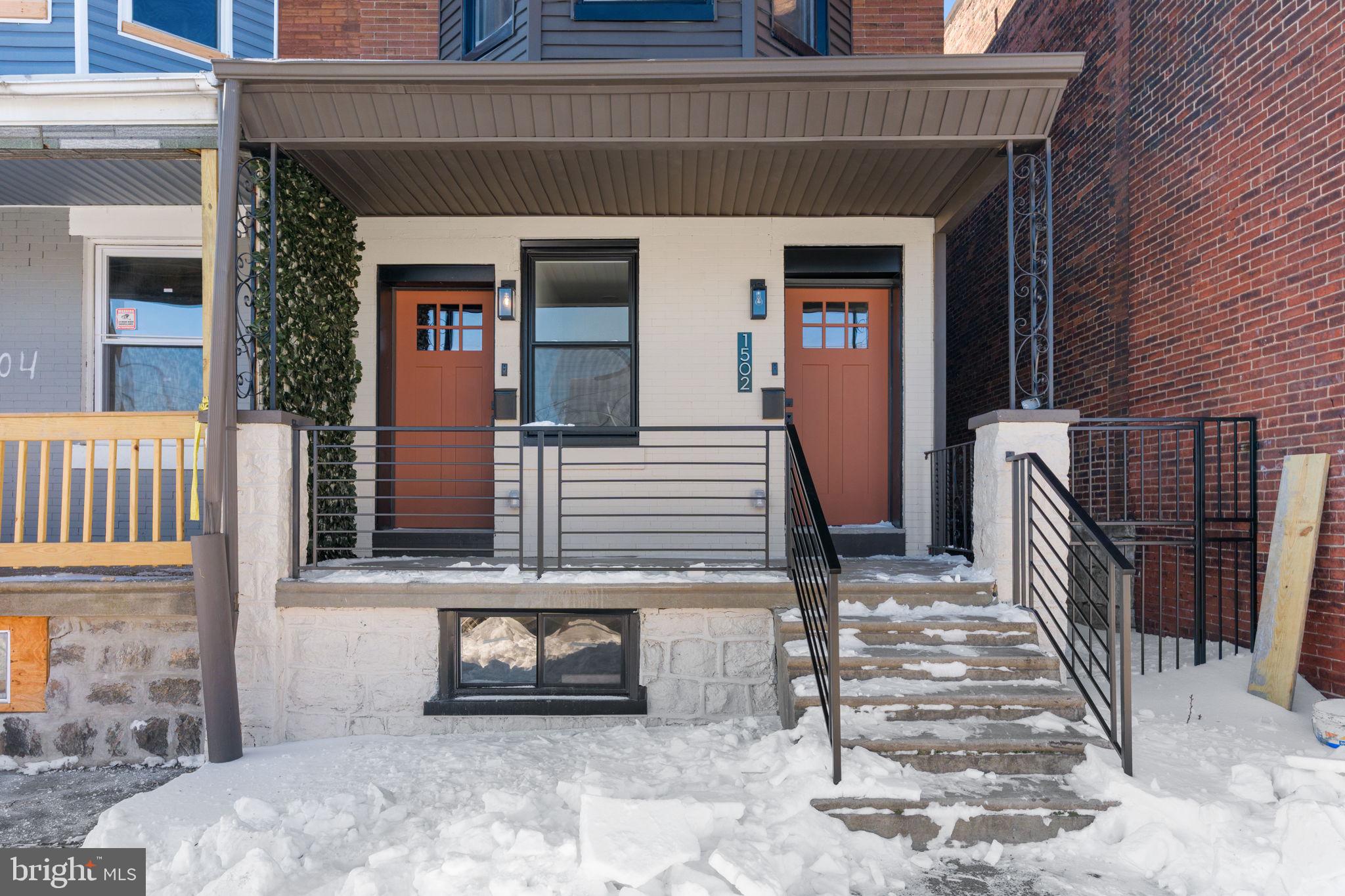 1502 South 52nd Street Philadelphia, PA 19143 - Photo 3 of 34 a view of a house with a door and wooden fence