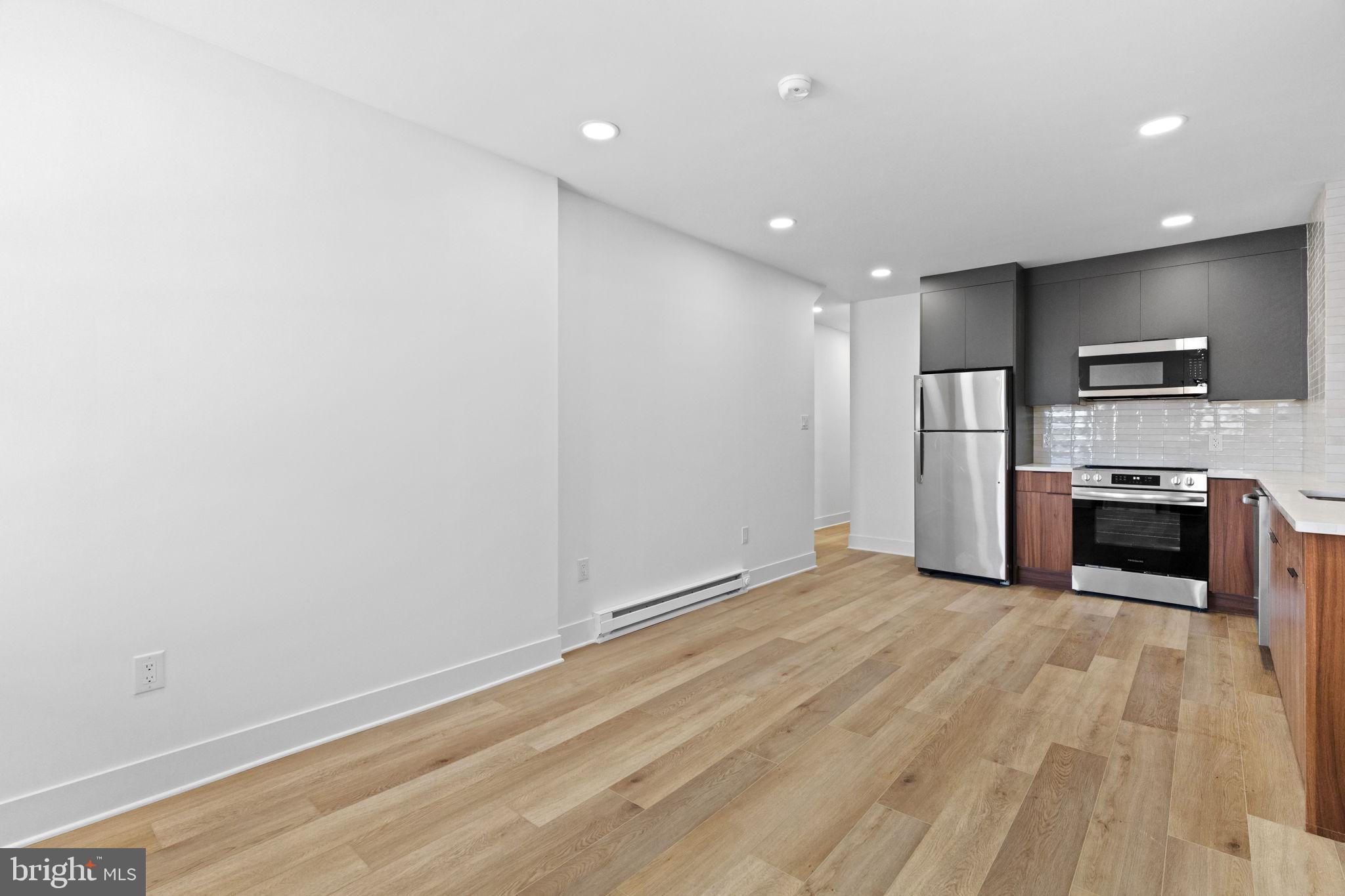 1502 South 52nd Street Philadelphia, PA 19143 - Photo 7 of 34 a view of kitchen with microwave and refrigerator