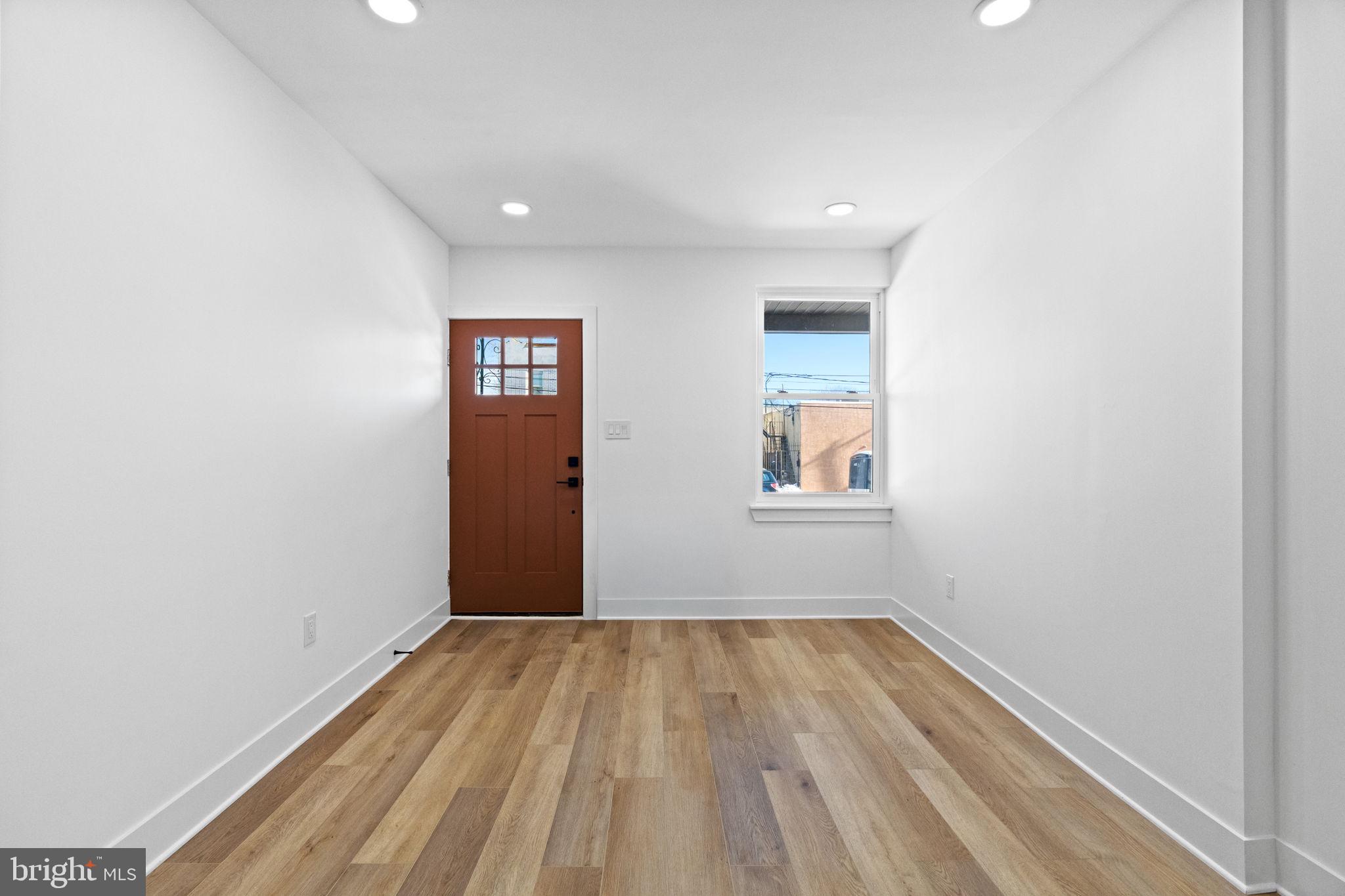 1502 South 52nd Street Philadelphia, PA 19143 - Photo 8 of 34 a view of a hallway with wooden floor