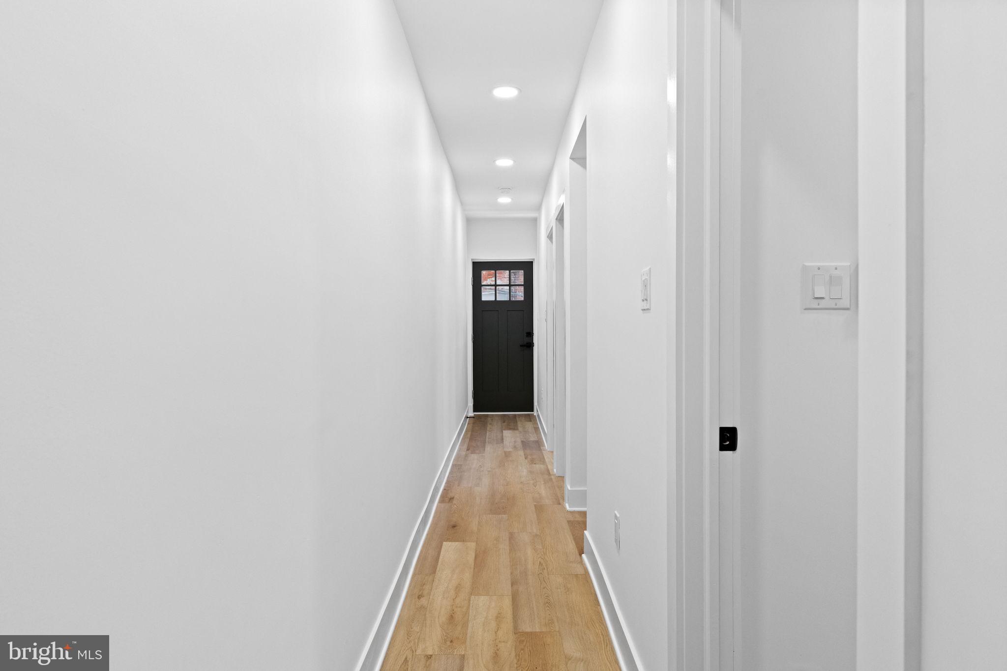 1502 South 52nd Street Philadelphia, PA 19143 - Photo 9 of 34 a view of a hallway with wooden floor