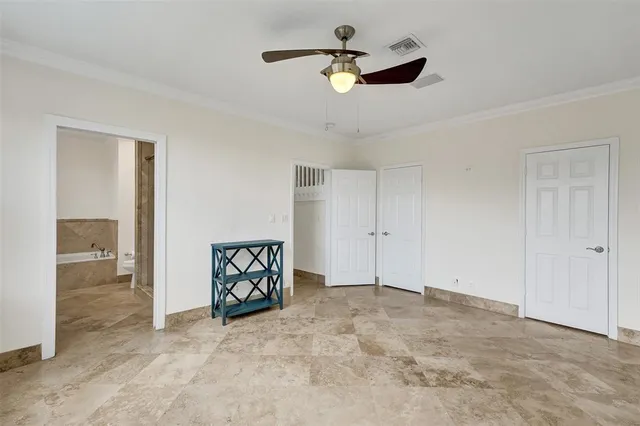 a bathroom with a tub sink double vanity and a mirror